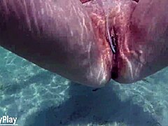 mature milf's shaved pussy filled with creampie underwater closeup