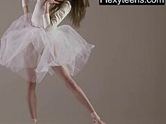 Blonde gymnast stretches flexibly during naked yoga workout in gym