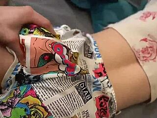 Eating snacks with my sister while using the computer in a nerdy setup.