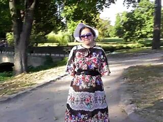 This hairy mature lady casually flashes her beaver and pussy while strolling in the park